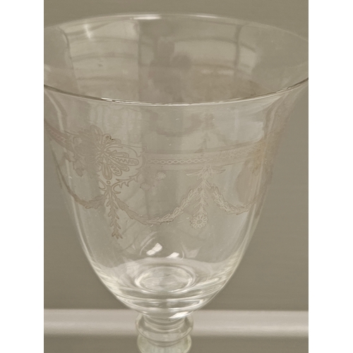 91 - A Suite Of 17 Etched Wine Glasses