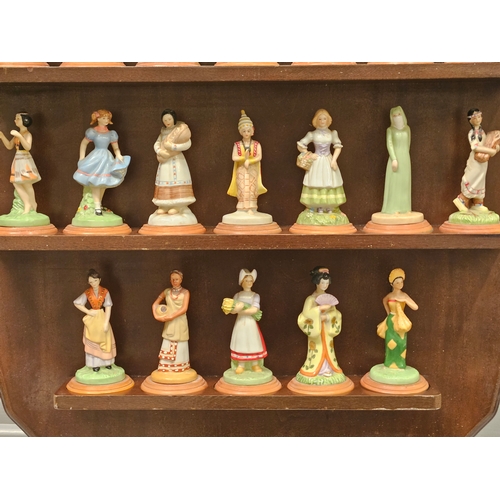 167 - 26 'Lovely Ladies Of Many Lands' From The Danbury Mint Figurines On Mahogany Stand