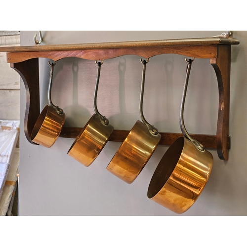 400 - A Set Of 4 Copper Pans On Mahogany Display Rack