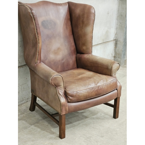 824 - Brown Leather Wing Back Armchair