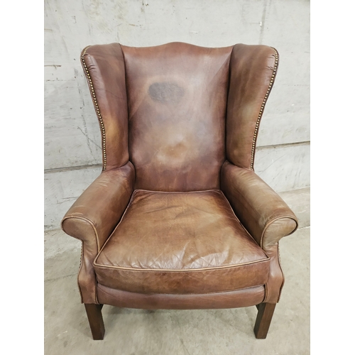 824 - Brown Leather Wing Back Armchair