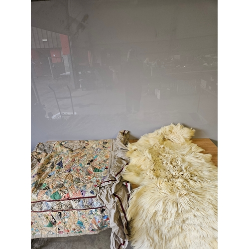 Quilted Bed Cover & Goat Skin Rug