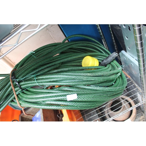 64 - LARGE GREEN GARDEN HOSE