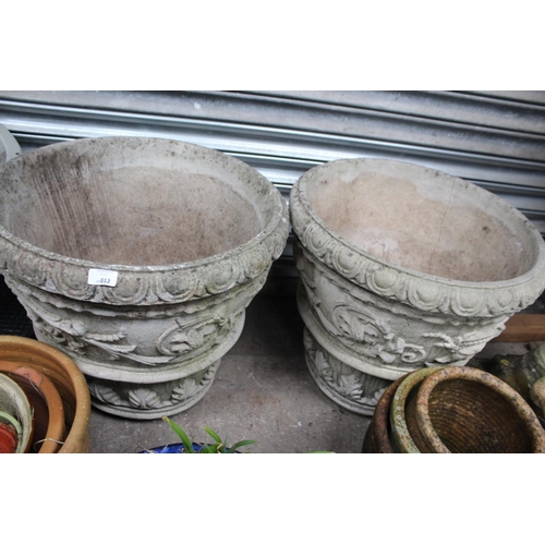 12 - PAIR OF VERY LARGE EMBOSSED CONCRETE PLANTERS