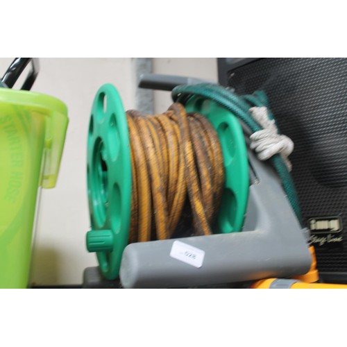 28 - GARDEN HOSE ON REEL WITH SPRAYER HEAD