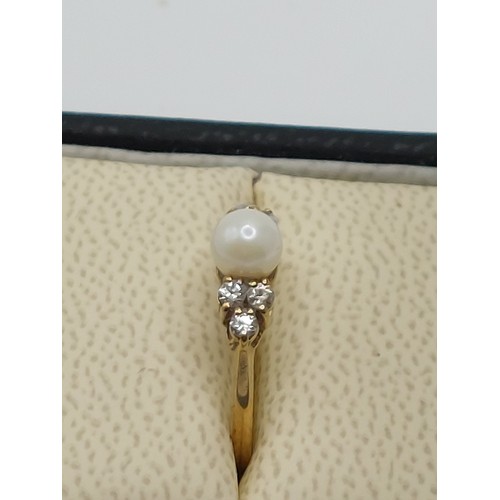 344 - 9ct GOLD PEARL SOLITAIRE WITH ACCENTS. 
RING SIZE ‘K’ HALLMARKED