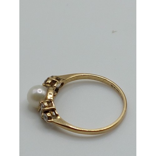 344 - 9ct GOLD PEARL SOLITAIRE WITH ACCENTS. 
RING SIZE ‘K’ HALLMARKED