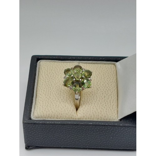 361 - 10ct WHITE GOLD TOURMALINE CLUSTER RING SIZE ‘O’. WEIGHT 3.3gms HALLMARKED