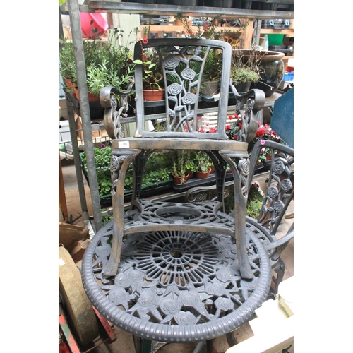 181 - ORNATE PLASTIC GARDEN TABLE AND PAIR OF MATCHING CHAIRS