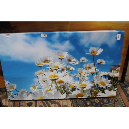 599 - 2 CANVAS PRINTS. 1 OF DAISIES. 1 OF A SUNSET