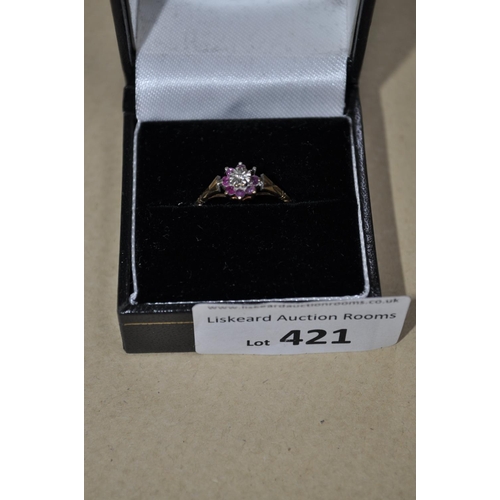 421 - 9 CARAT GOLD RUBY AND DIAMOND RING, (1 STONE MISSING) SIZE M 1/2