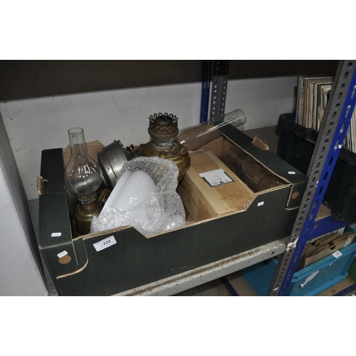 229 - LARGE BOX OF BRASS OIL LAMPS AND CHIMNEYS
