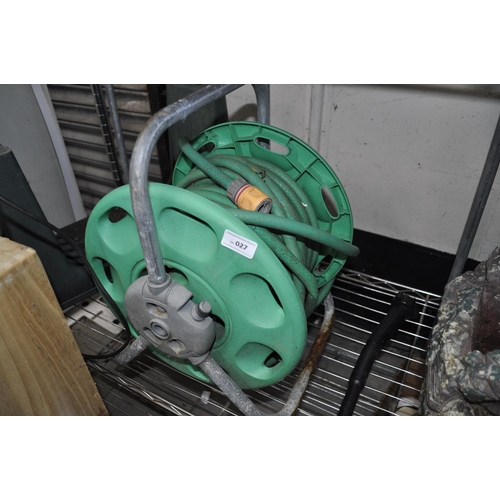 27 - GREEN HOSE ON REEL