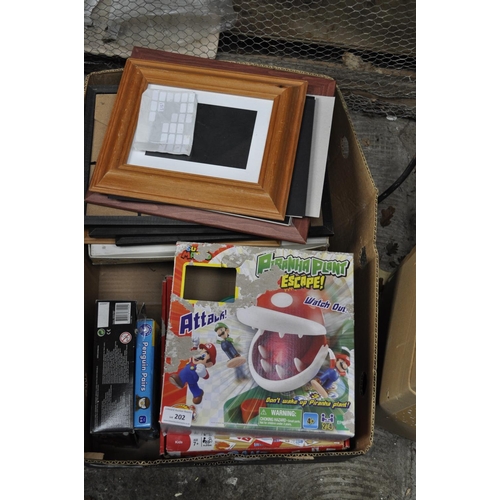 202 - BOX OF ASSORTED PICTURE FRAMES AND TOYS