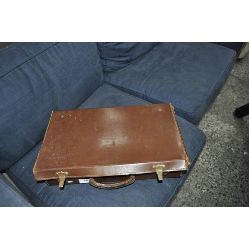 672 - SMALL LEATHER SUITCASE