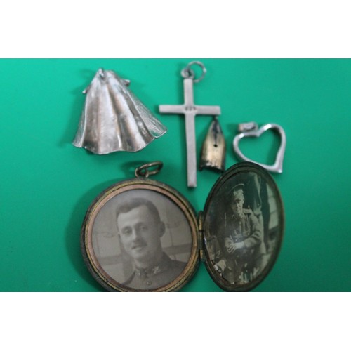 44 - MIXED BAG INC 
GOLD COLOURED LOCKET WITH WAR PICS 
925 SILVER CRUCIFIX AND 925 HEART PENDANT 3.6G ON... 