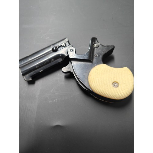 62 - ITALIAN DERRINGER STARTING PISTOL A/F  WITH HOLSTER AND BELT SLIP