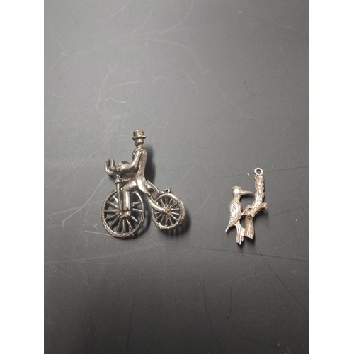 57 - PENNY FARTHING BROOCH AND UNMARKED PROBABLY SILVER MOVING WOODPECKER PENDANT