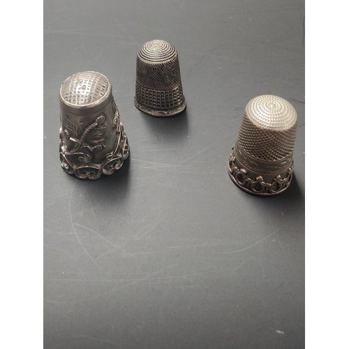 98 - 3 THIMBLES  1 IS FULLY HALLMARKED  AND OTHER 2 ARE WHITE METAL  BUT BELIEVED TO BE SILVER ALSO   9.8... 