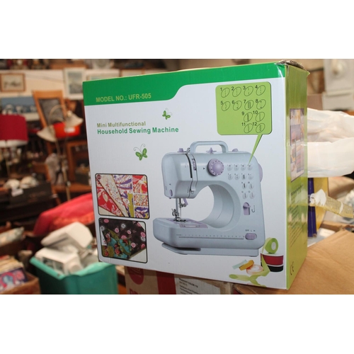 396 - BOXED MULTI FUNCTION HOUSEHOLD SEWING MACHINE