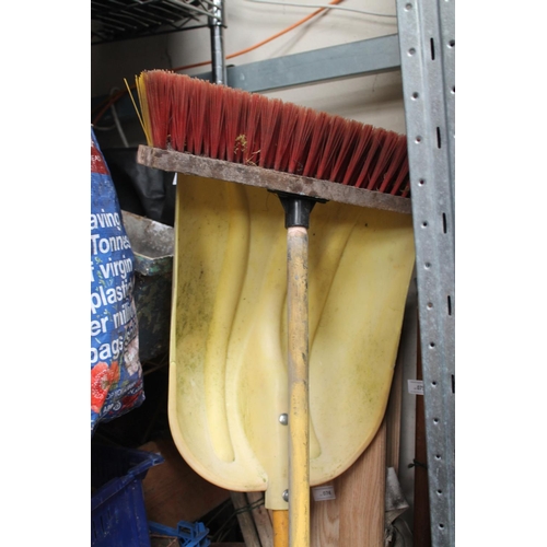 73 - LARGE PLASTIC SHOVEL AND GOOD STIFF BROOM