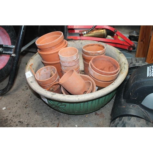 240 - CERAMIC GLAZED PLANTER WITH A QUANTITY OF TERRACOTTA PLANT POTS