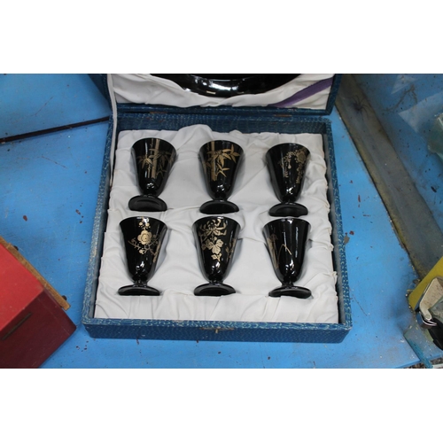 665 - BLACK AND GOLD ORIENTAL PLATE AND CUP SET