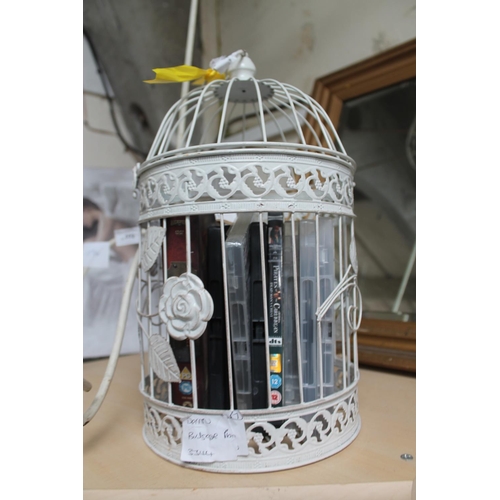 773 - WHITE WIRE BIRD CAGE WITH DVDs