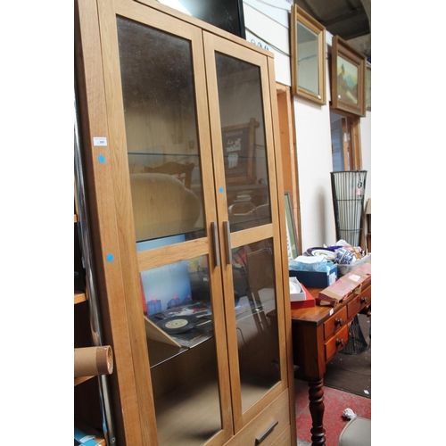 389 - LIGHT OAK 2 DOOR GLAZED CABINET WITH 2 DRAWERS  VERY HEAVY