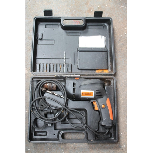 64 - CASED CHALLENGE ELECTRIC DRILL, WORKING ORDER