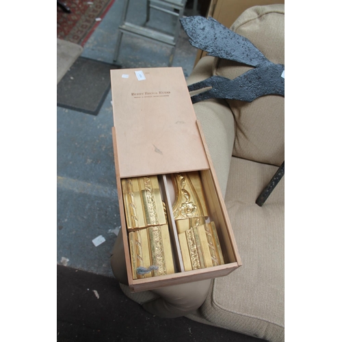 692 - WINE BOX CONTAINING WOODEN GILT DECORATIONS FOR ARMCHAIRS