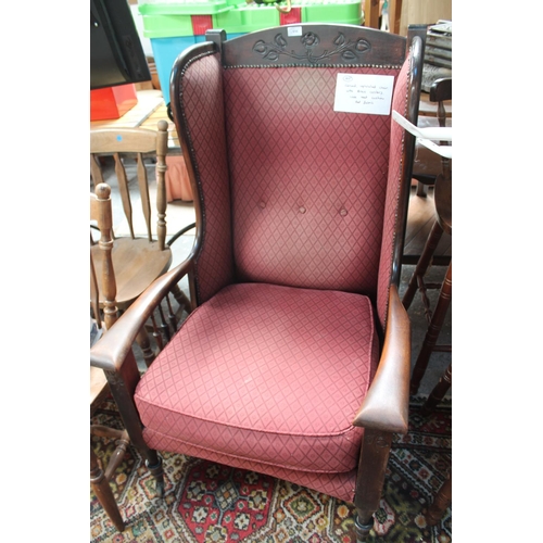 698 - CARVED UPHOLSTERED CHAIR WITH BRASS CASTORS AND RED LOOSE SEAT CUSHION