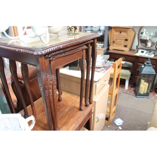 606 - MAHOGANY NEST OF TABLES WITH GLASS TOPS