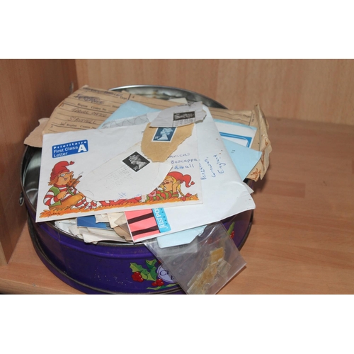 568 - LARGE TIN OF STAMPS AND POSTCARDS