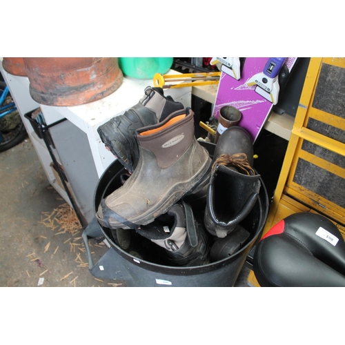 196 - BLACK DUSTBIN WITH CONTENTS OF WORKMANS BOOTS