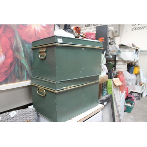 200 - PAIR OF GREEN METAL CRESTED STORAGE TRUNKS