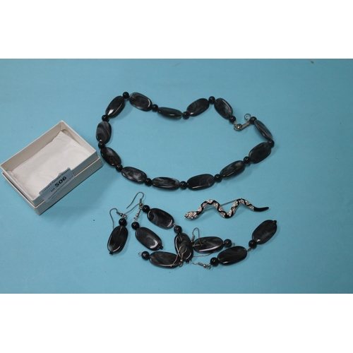 506 - BLACK AND GREY POLISHED MARBLE EFFECT SET INCLUDING EARRINGS AND A NECKLACE