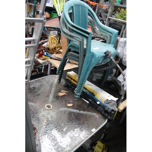 128 - GLASS TOP GARDEN TABLE AND 4 GREEN GARDEN CHAIRS