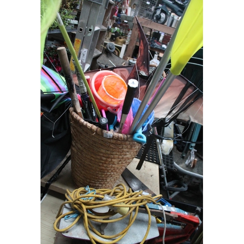157 - BUCKET CONTAINING STUNT KITES, RACKETS AND BUCKETS AND SPADES