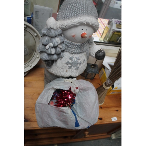 329 - HEAVY FREE STANDING SNOWMAN HOLDING LANTERN AND XMAS LIGHTS