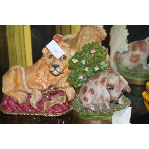 338 - VICTORIAN LOOKING PIG AND LION FIGURES