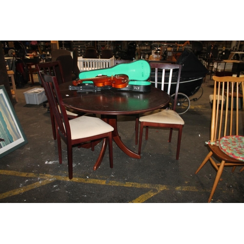 653 - A DARK WOOD DROP LEAF TABLE WITH FOUR MATCHING CHAIRS