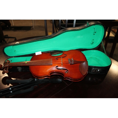 654 - THE CASED CHILED VIOLIN WITH STAND AND CASE