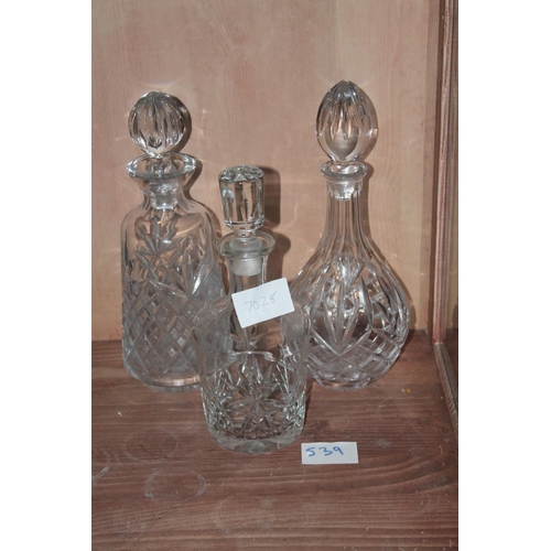 539 - 3 HEAVEY GLASS DECANTERS WITH LIDS