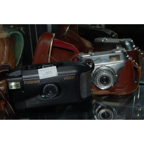 365 - POLAROID CAMERA AND A CASED ARETTE CAMERA