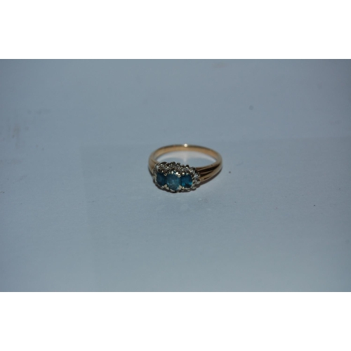 387 - 9CT GOLD DIAMOND AND 3 STONE BLUE RING (POSSIBLY TANZANITE OR TOPAZ) 3G  SIZE L-M