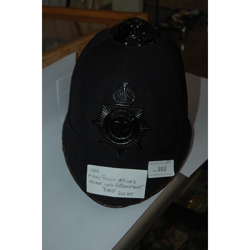 382 - A POLICE OFFICERS HELMET WITH NIGHT BADGE