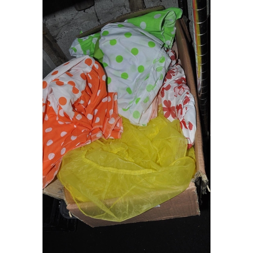 216 - LARGE BOX CONTAINING COLOURFUL SKIRTS, MATERIALS ETC