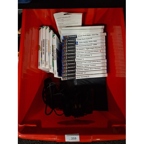 259 - BOX INC PS2 SLIM AND  PLAYSTATION 2 GAMES