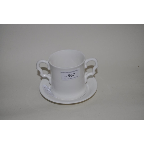 567 - DECORATIVE DOUBLE HANDLED PORCELAIN CUP AND SAUCER